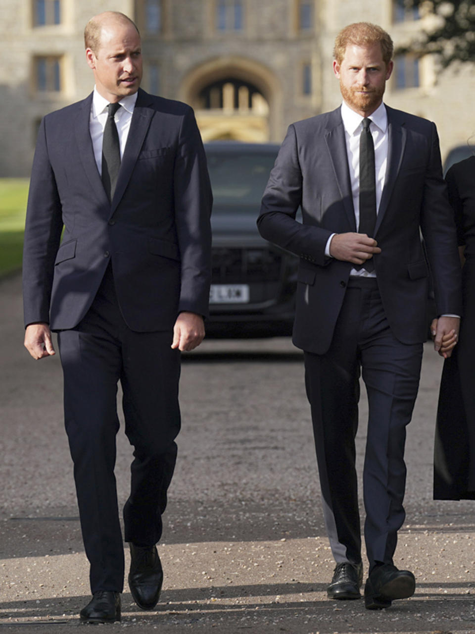 FILE - Britain's Prince William, Prince of Wales, left and Prince Harry walk to meet members of the public at Windsor Castle, following the death of Queen Elizabeth II on Thursday, in Windsor, England, Saturday, Sept. 10, 2022. Prince Harry has said he wants to have his father and brother back and that he wants “a family, not an institution,” during a TV interview ahead of the publication of his memoir. The interview with Britain’s ITV channel is due to be released this Sunday. (Kirsty O'Connor/Pool Photo via AP, File)