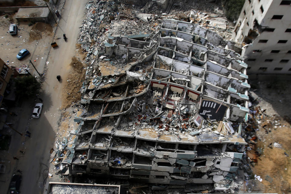 The destroyed building housing the offices of The Associated Press and other media, after it was hit last week by Israeli airstrike, in Gaza City, Friday, May 21, 2021. A cease-fire took effect early Friday after 11 days of heavy fighting between Israel and Gaza's militant Hamas rulers that was ignited by protests and clashes in Jerusalem. (AP Photo/Hatem Moussa)