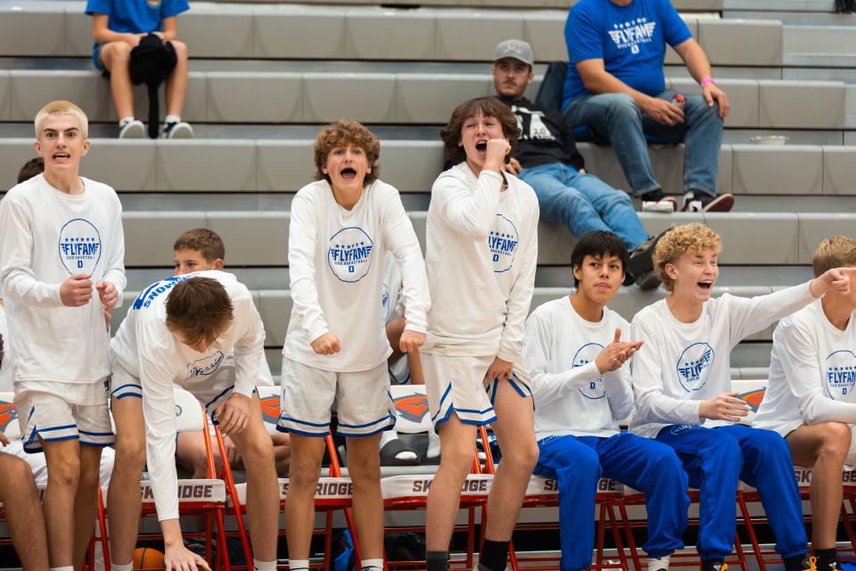 Dixie High School celebrates during a boys basketball semifinal game against Herriman High School at the Allstate Falcon Classic at Skyridge High School in Lehi on Friday, Dec. 8, 2023. Dixie won the game. | Megan Nielsen, Deseret News