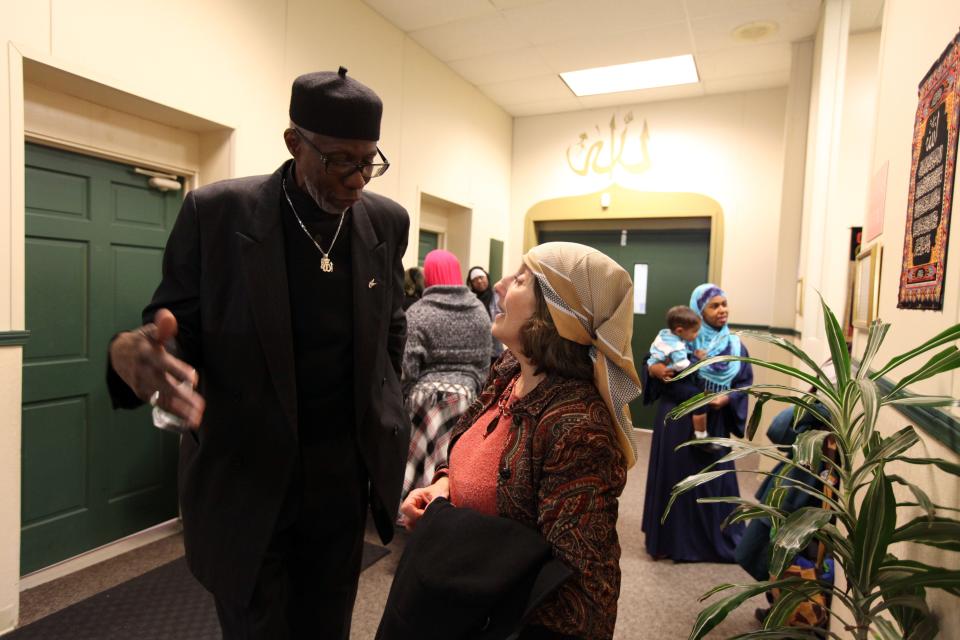 Imam Abdullah El-Amin, of the Muslim Center in Detroit, greets Rabi Dorit Edut, of the Downtown Synagogue, after Friday prayer service,  The Muslim Center welcomed members of the Jewish community in efforts to find peace in prayer on Friday, Nov. 16, 2012.
(Photo: JESSICA J. TREVINO, Detroit Free Press)