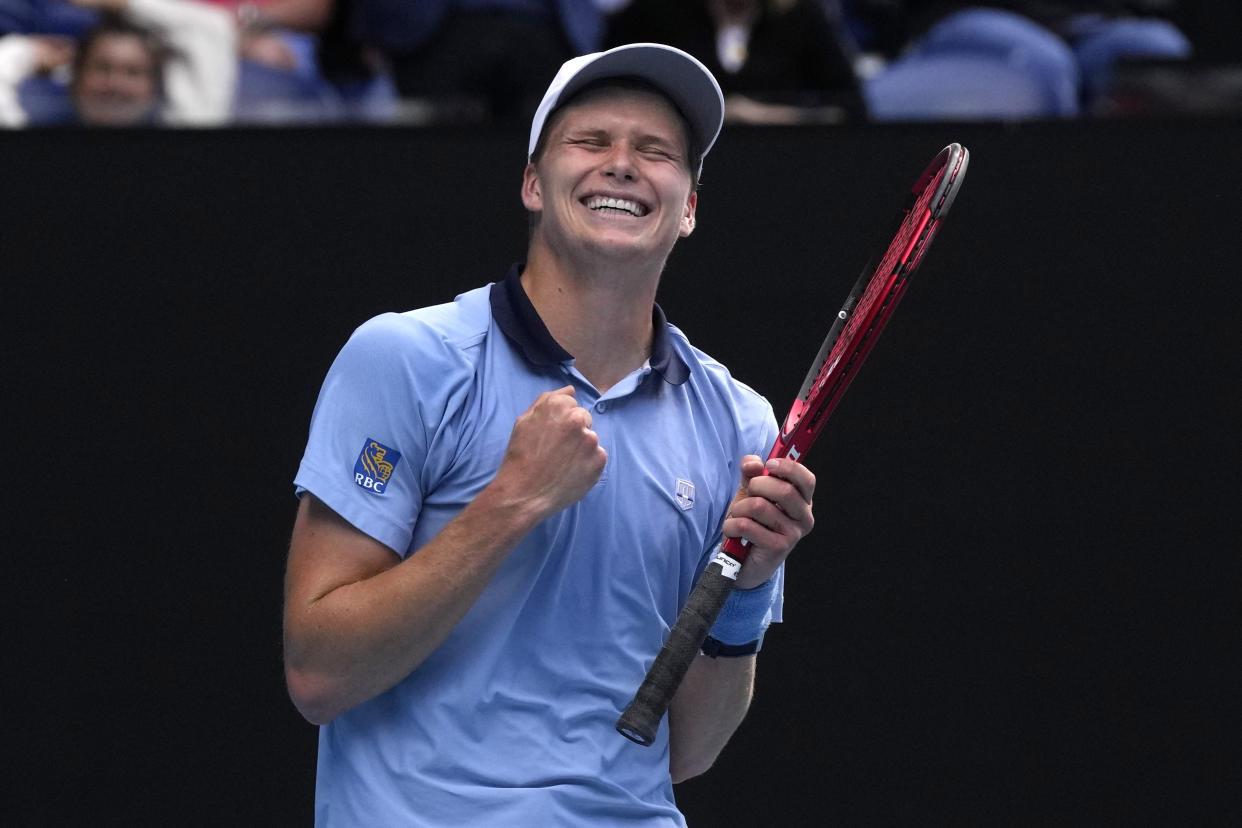 Jenson Brooksby of the U.S. celebrates after defeating Casper Ruud of Norway in their second round match at the Australian Open tennis championship in Melbourne, Australia, Thursday, Jan. 19, 2023. (AP Photo/Dita Alangkara)