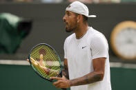 Australia's Nick Kyrgios shouts towards his coaching team during a men's singles quarterfinal match against Chile's Cristian Garin on day ten of the Wimbledon tennis championships in London, Wednesday, July 6, 2022. (AP Photo/Alberto Pezzali)
