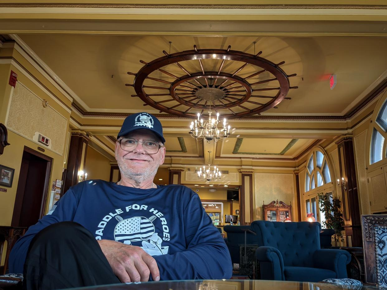 Curtis Casto takes a break from his 980-mile Ohio River kayak trip with a little glamping at the historic Lafayette Hotel in Marietta.