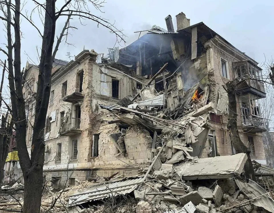 Debris of an apartment building damaged in a Russian rocket attack in Kryvyi Rih, Ukraine, Friday, Dec. 16, 2022. Russian forces launched at least 60 missile strikes across Ukraine on Friday, officials said, reporting explosions in at least four cities. At least two people were killed when a residential building was hit in central Ukraine, while electricity and water services were interrupted in the two largest cities, Kyiv and Kharkiv. (Ukrainian Emergency Service via AP Photo)