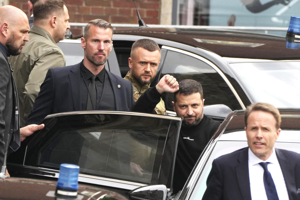 Ukraine's President Volodymyr Zelenskyy, second right, gestures as he leaves after receiving the International Charlemagne Prize in Aachen, Germany, Sunday, May 14, 2023. Ukraine's President Volodymyr Zelenskyy and the people of Ukraine received the International Charlemagne Prize on Sunday for contributions to European unity. (AP Photo/Michael Probst)