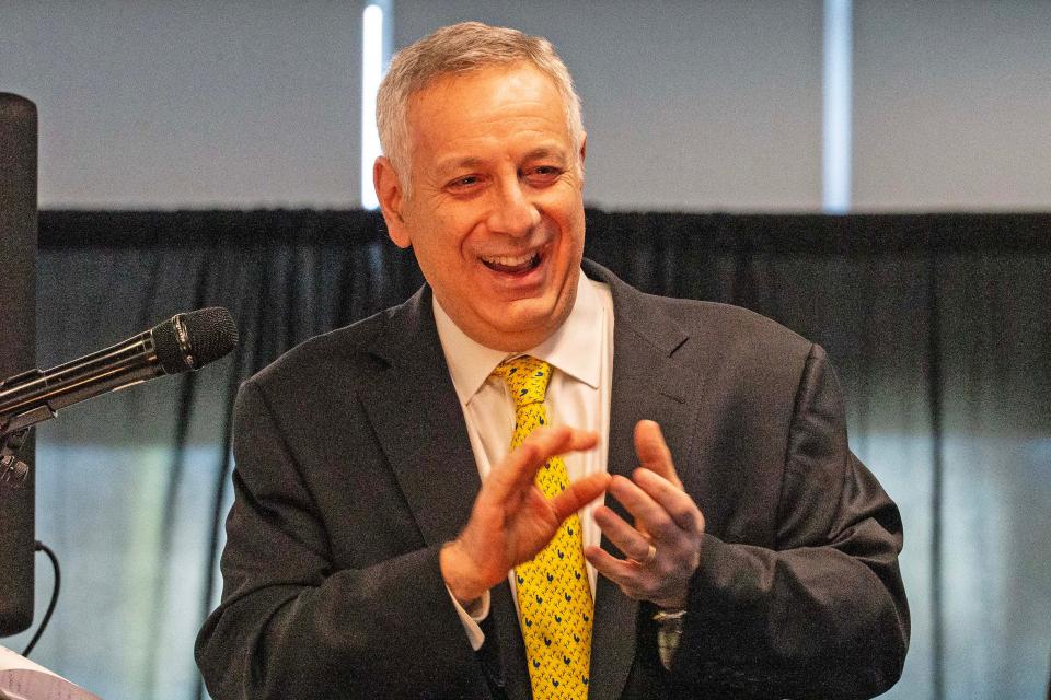 UD President Dennis Assanis reacts during a press conference at UD's Whitney Athletic Center in Newark, Wednesday, Nov. 29, 2023. The University of Delaware formally announced at the press conference that it has accepted an invitation to join Conference USA as a full-league member effective July 1, 2025.