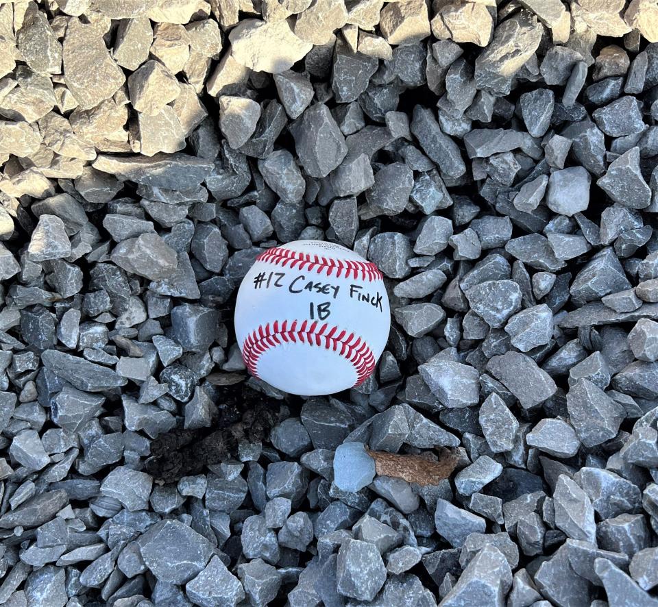 Casey Fink, who was the Ohio Capital Conference Player of the Year his sophomore and junior seasons, is one of nine seniors to have his ball buried at his position on Lancaster's new baseball field.