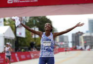 Sifan Hassan celebrates her Chicago Marathon course record victory in Chicago's Grant Park on Sunday, Oct. 8, 2023. (Eileen T. Meslar /Chicago Tribune via AP)