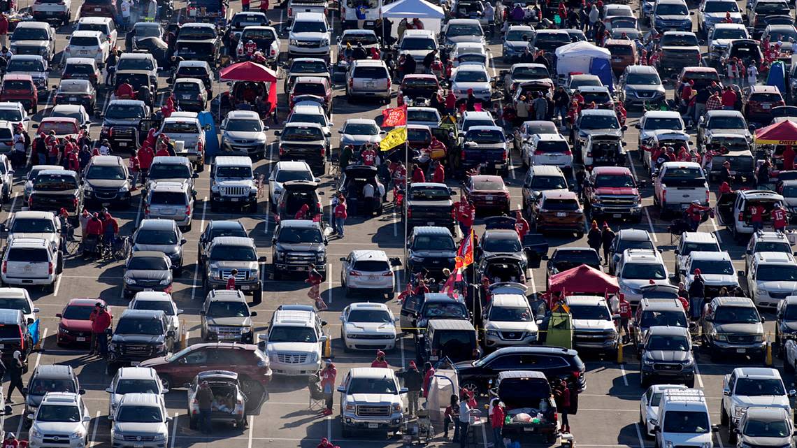 Fans tailgate in the parking lot outside Arrowhead Stadium before the game between the Kansas City Chiefs and the Las Vegas Raiders on Sunday, Dec. 12, 2021.
