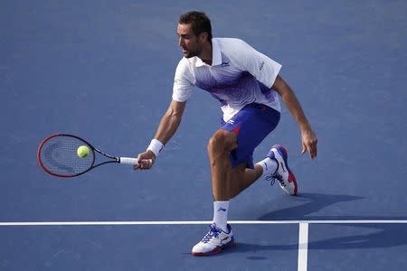 Aug 31, 2015; New York, NY, USA; Marin Cilic of Croatia hits a volley against Guido Pella of Argentina (not pictured) on day one of the 2015 U.S. Open tennis tournament at USTA Billie Jean King National Tennis Center. Cilic won 6-3, 7-6 (3), 7-6 (3). Mandatory Credit: Geoff Burke-USA TODAY Sports