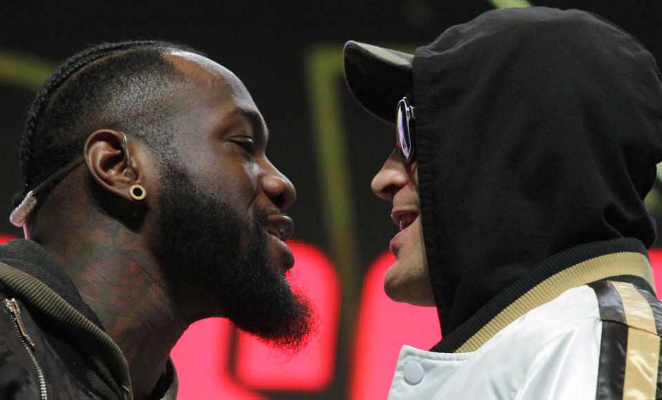 US boxer Deontay Wilder (L) and British boxer Tyson Fury get into an altercation during their press conference February 19, 2020 at the MGM Grand Las Vegas in Las Vegas, Nevada. - The boxers will fight for the World Boxing Council (WBC) Heavyweight Championship Title on February 22, 2020 at the MGM Grand Garden Arena in Las Vegas. (Photo by John Gurzinski / AFP) (Photo by JOHN GURZINSKI/AFP via Getty Images)