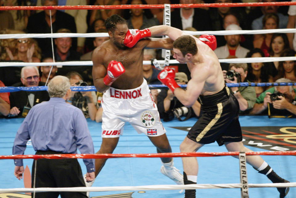 Vitali Klitschko (R) lands a right on Lennox Lewis in their classic 2003 heavyweight title bout in Los Angeles. (Getty Images)