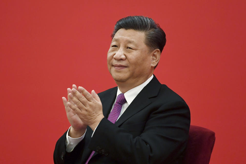 CORRECTS DATE OF XI'S VISIT, FILE - China's President Xi Jinping claps as he listens to Russian President Vladimir Putin via a video link, from the Great Hall of the People in Beijing on Dec. 2, 2019. China said Friday, March 17, 2023, President Xi will visit Russia from Monday, March 20, to Wednesday, March 22, 2023, in an apparent show of support for Russian President Putin. (Noel Celis/Pool Photo via AP, File)