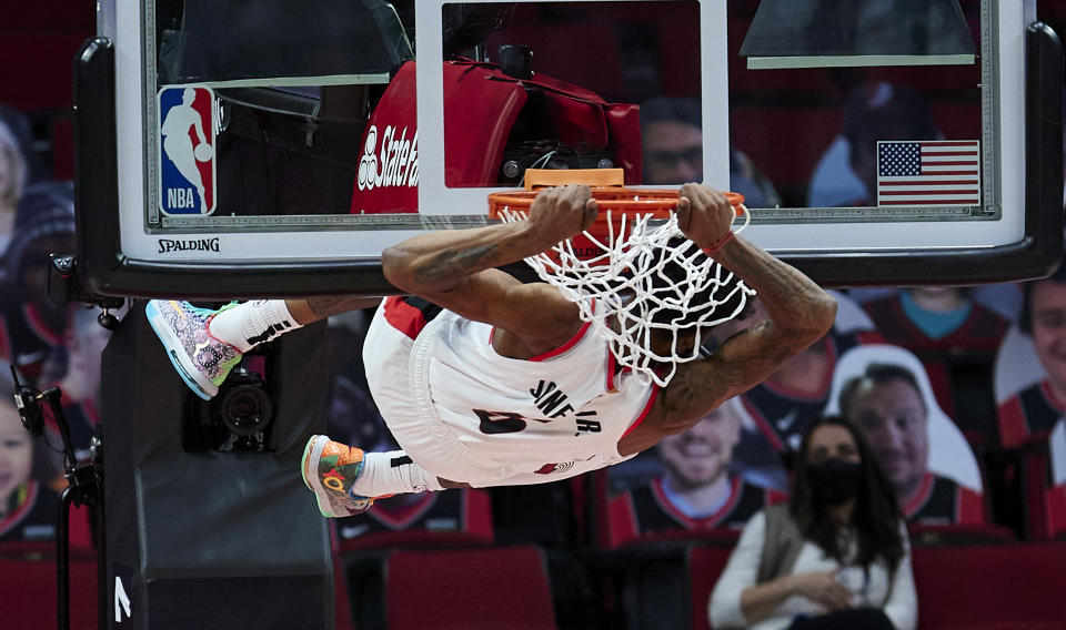 Portland Trail Blazers forward Derrick Jones Jr. dunks against the Miami Heat during the first half of an NBA basketball game in Portland, Ore., Sunday, April 11, 2021. (AP Photo/Craig Mitchelldyer)