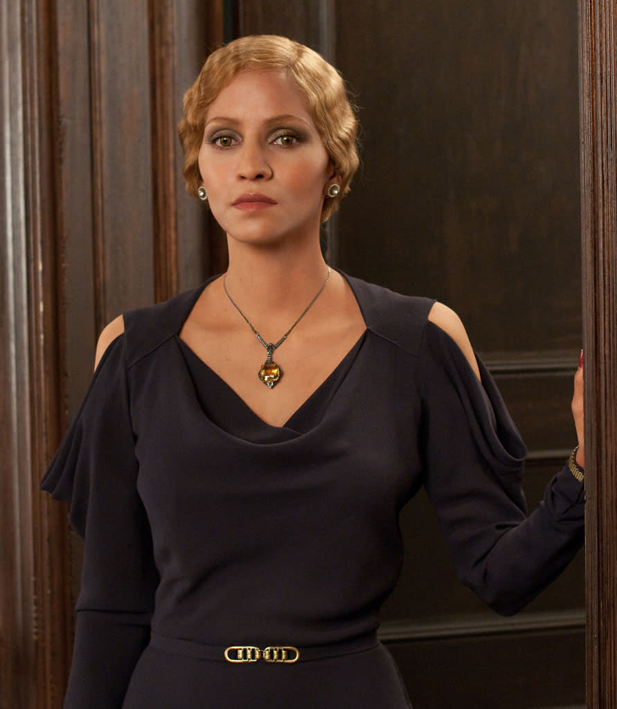 Halle Berry's seductive black dress in "Cloud Atlas" was designed by Kym Barrett and Pierre-Yves Gayraud.
