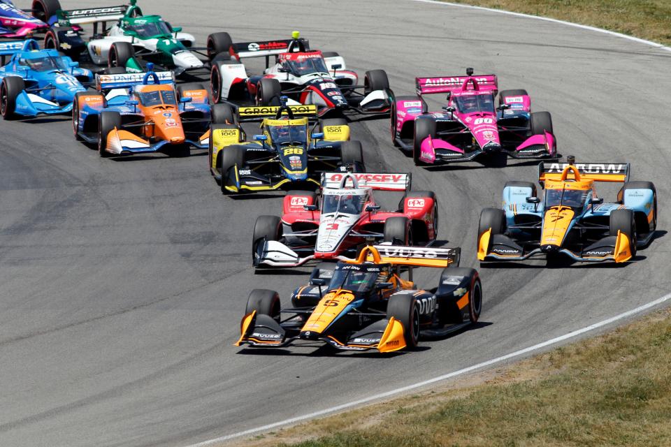 Pato O'Ward leads the field at the drop of the green flag during an IndyCar auto race at Mid-Ohio Sports Car Course in Lexington, Ohio, Sunday, July 3, 2022.