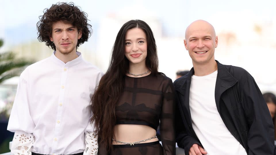 From left: Mark Eydelshteyn, Mikey Madison, in Chanel, and Jurij Borisov on May 22. - Andreas Rentz/Getty Images