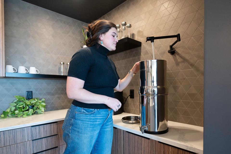 McCall Knecht fills a Boroux full water system at the James Enterprise Inc. office on Wednesday, January 17, 2023.