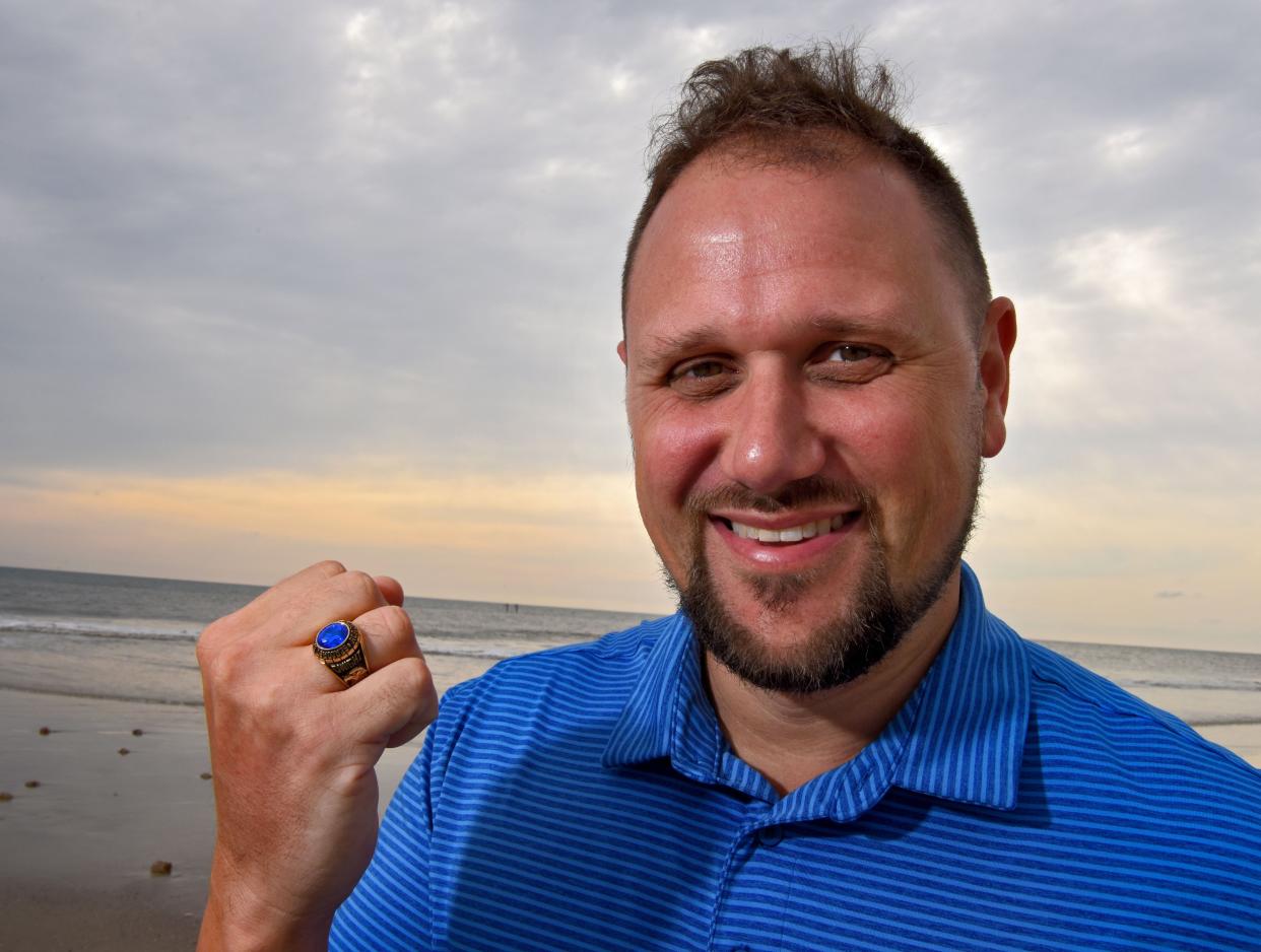 Dwight Cenac displays his class ring that was returned after 20 years.