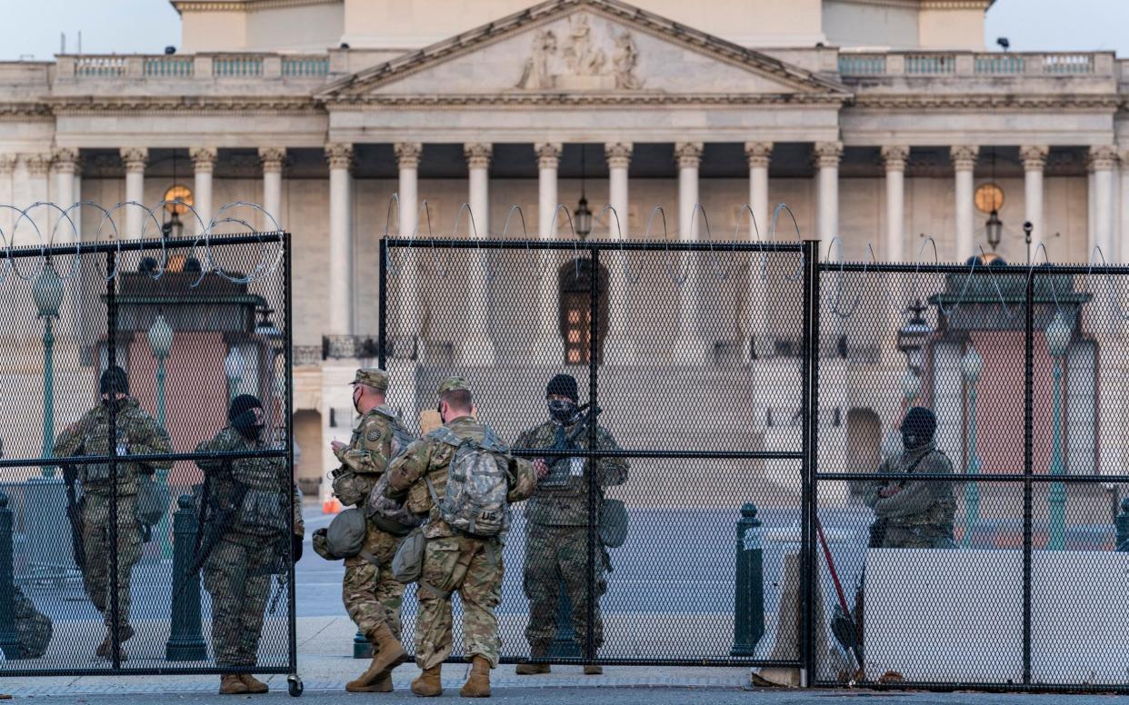 National Guard troops keep watch at the Capitol in Washington - AP Photo/J. Scott Applewhite