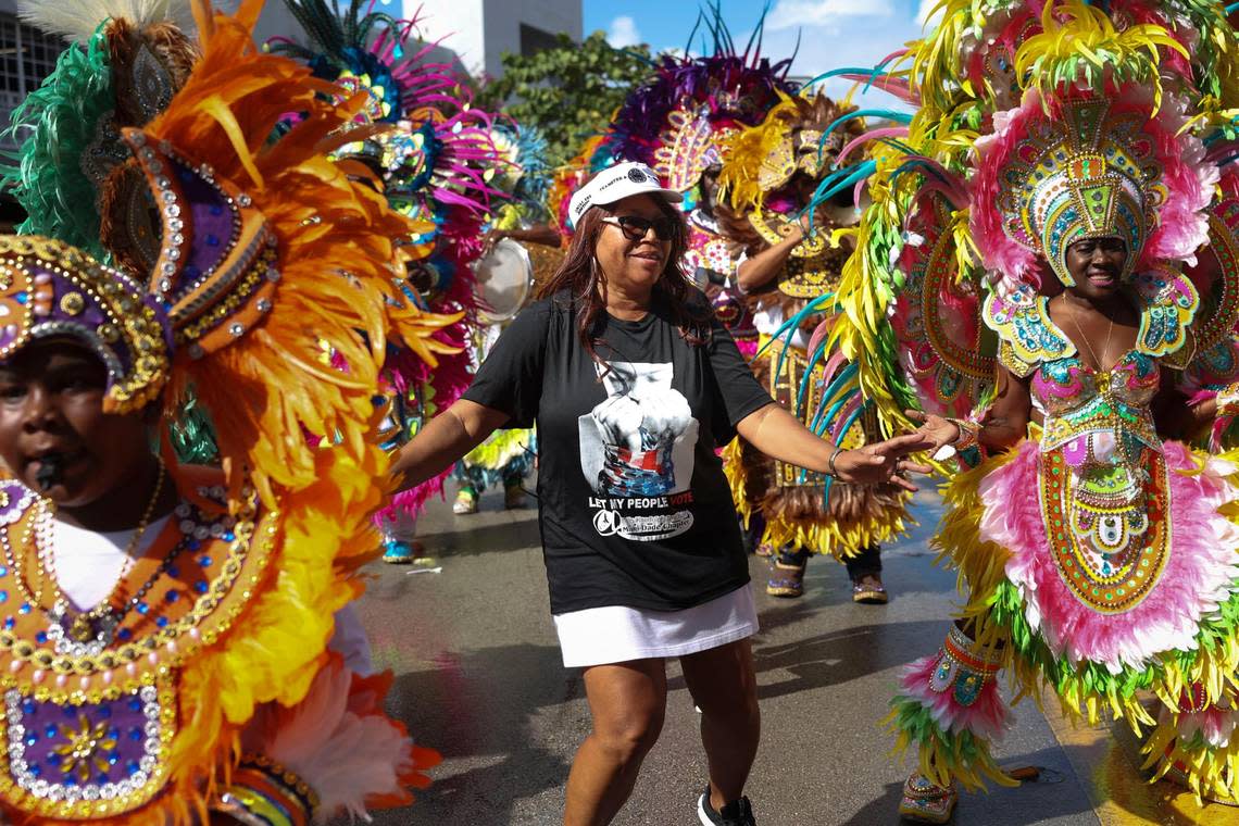Valda McKinney, president of the A. Philip Randolph Institute Miami-Dade Chapter, dances with the Junkanoo band during a Souls to the Polls event outside of the Joseph Caleb Center on Sunday, Nov. 6, 2022, in Liberty City.