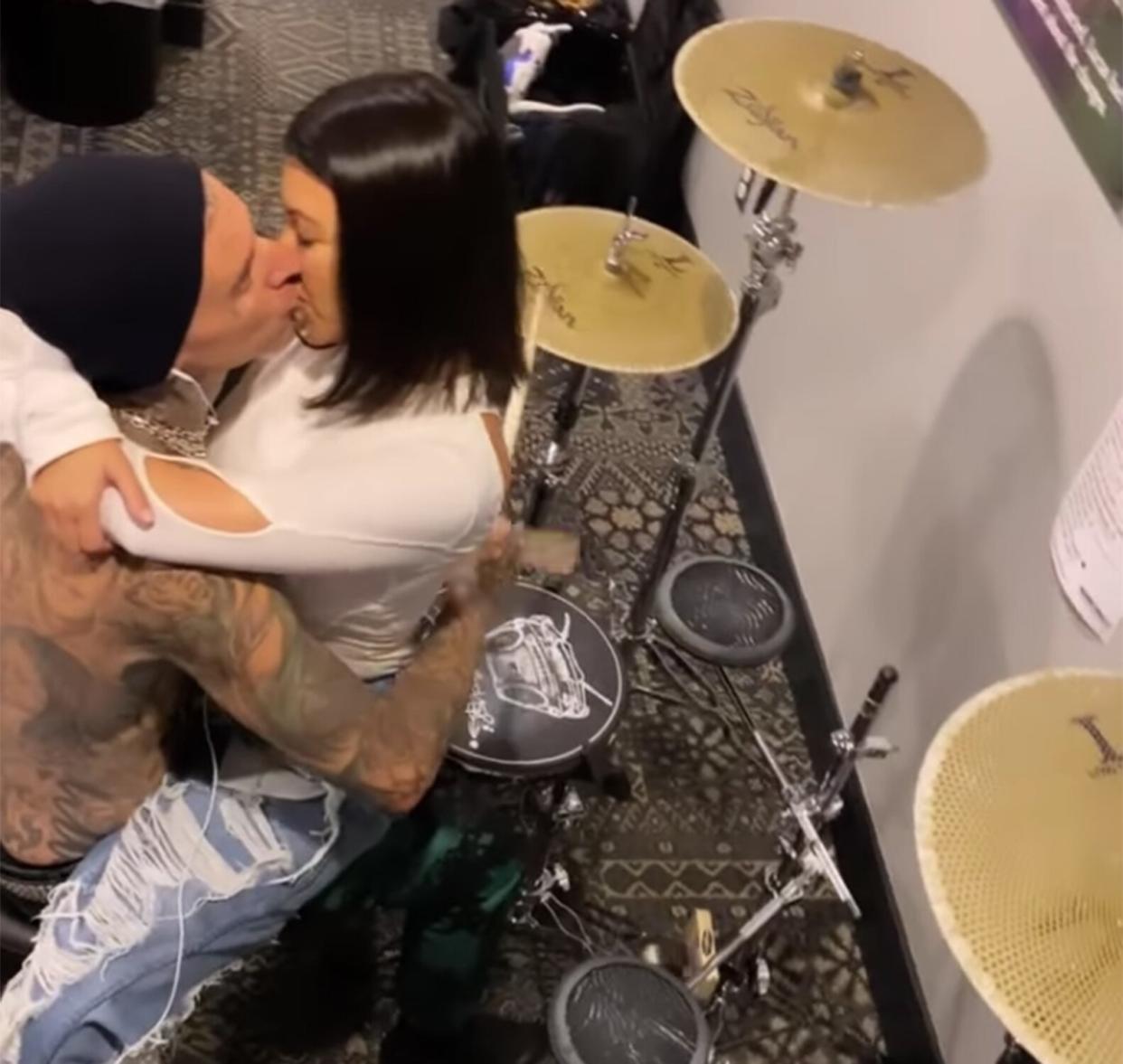 Travis Barker Plays the Drums with Kourtney on His Lap