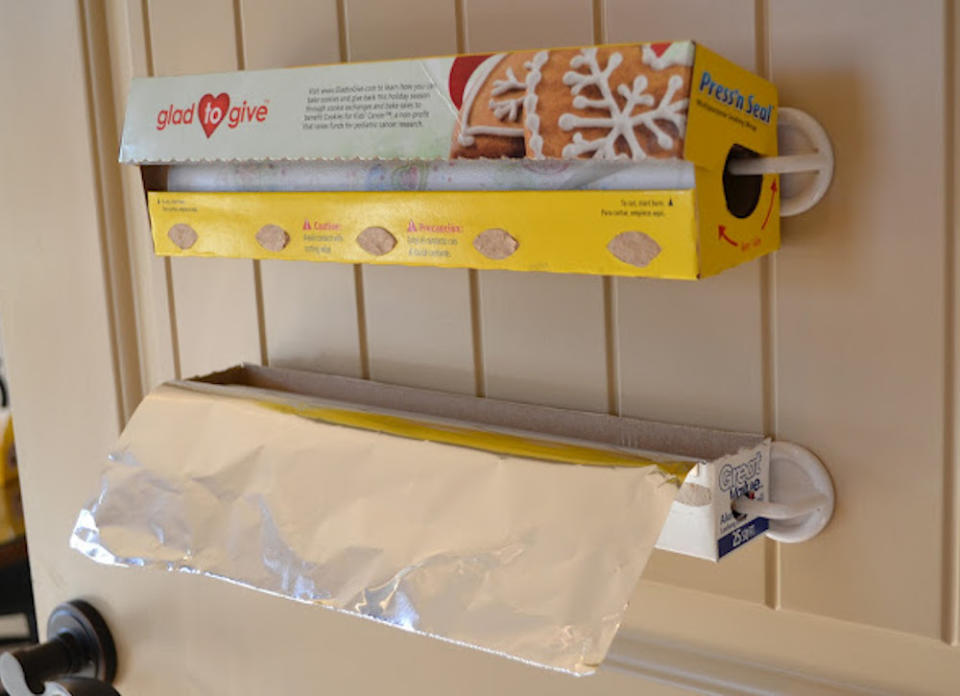 <body> <p>If bulky boxes of plastic wrap and aluminum foil are adding to the chaos of your kitchen cabinets or jam-packed drawers, transplant them to the back of a cabinet door. Secure two <a rel="nofollow noopener" href=" http://www.bobvila.com/slideshow/7-clever-ways-for-hooks-to-streamline-your-life-48763?bv=yahoo" target="_blank" data-ylk="slk:self-adhesive hooks;elm:context_link;itc:0;sec:content-canvas" class="link ">self-adhesive hooks</a> to the wall for every holder, then slide the ends of each box around the hooks to keep them in close reach for wrapping up leftovers.</p> <p><strong>Related: <a rel="nofollow noopener" href=" http://www.bobvila.com/slideshow/11-surprising-uses-for-aluminum-foil-49000#.V-VBF5MrKRs?bv=yahoo" target="_blank" data-ylk="slk:11 Surprising Uses for Aluminum Foil;elm:context_link;itc:0;sec:content-canvas" class="link ">11 Surprising Uses for Aluminum Foil</a> </strong> </p> </body>