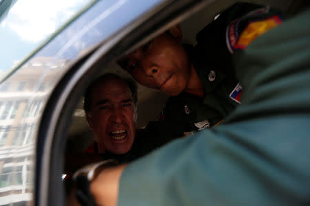 Australian filmmaker James Ricketson shouts inside a prison truck as he leaves the Municipal Court of Phnom Penh, Cambodia, August 31, 2018. REUTERS/Samrang Pring