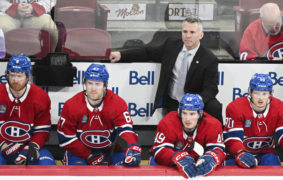 Montreal Canadiens coach Martin St. Louis stands behind the bench during the second period of the team's NHL hockey game against the New Jersey Devils on Saturday, March 11, 2023, in Montreal. (Graham Hughes/The Canadian Press via AP)