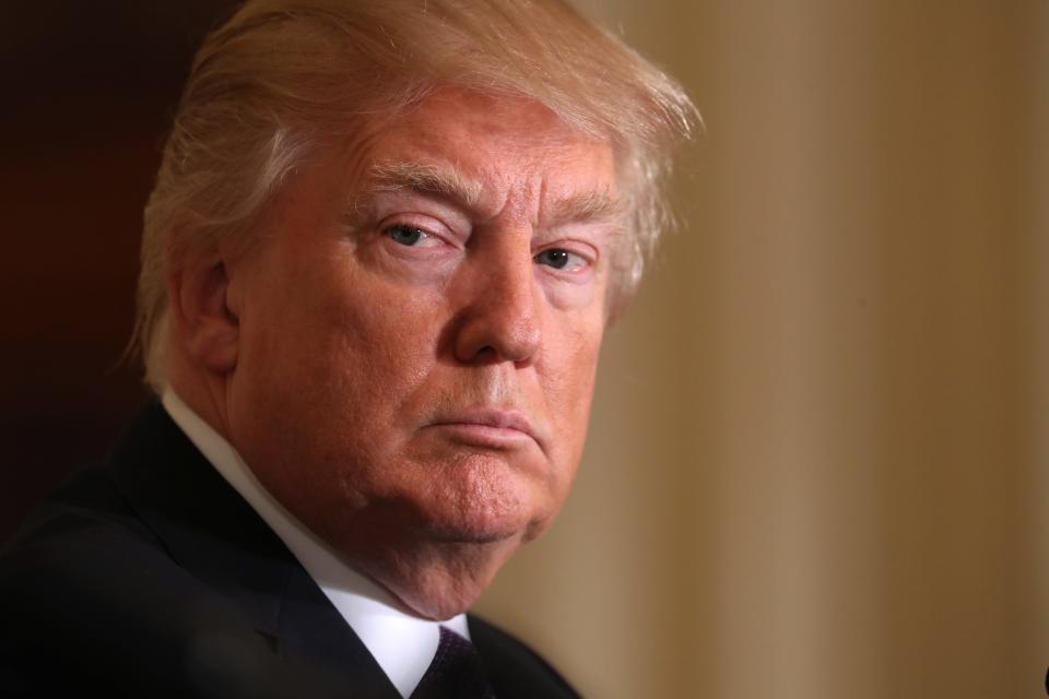 Donald Trump listens during a news conference with NATO Secretary General Jens Stoltenberg in the East Room of the White House in Washington, Wednesday, April 12, 2017.