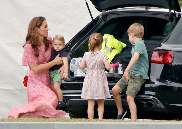 Max Mumby/Indigo/Getty Kate Middleton, Prince Louis, Princess Charlotte and Prince George at the King Power Royal Charity Polo Match