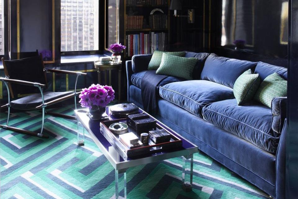 <p>This personality-packed den, boasting blue as its dominant color, showcases pops of teal accessories for an interesting mix. </p>