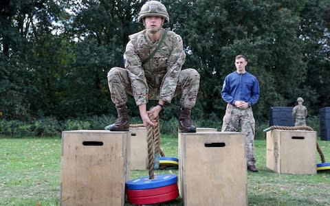 Soldiers demonstrate the vehicle casualty extraction stage in the British Army's New Physical Employment Standards  - Credit: Andrew Matthews/PA