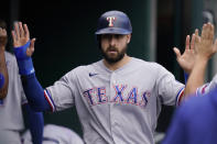 Texas Rangers designated hitter Joey Gallo is greeted in the dugout after scoring during the sixth inning of a baseball game against the Detroit Tigers, Thursday, July 22, 2021, in Detroit. (AP Photo/Carlos Osorio)