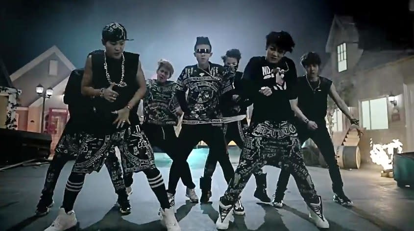 A screenshot of BTS dancing in the "No More Dream" music video