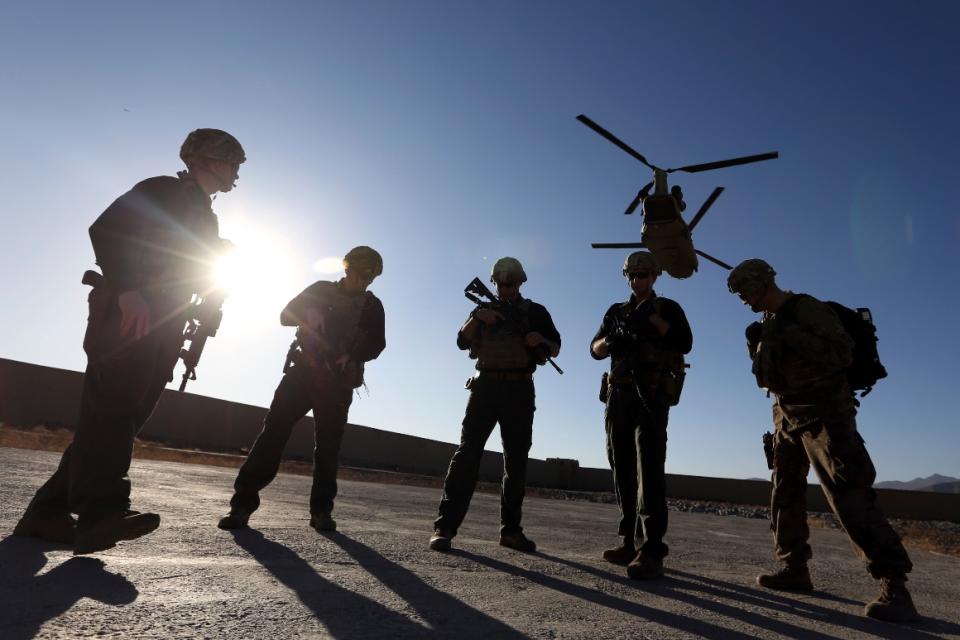 American soldiers wait on the tarmac in Logar province, Afghanistan.