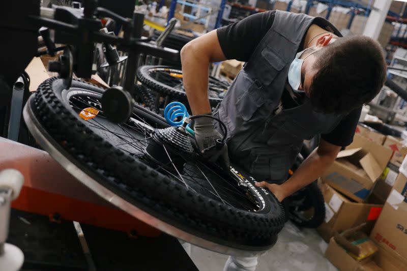 A worker is seen in InCycles bicycles factory in Anadia