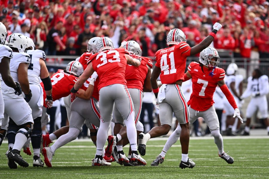 COLUMBUS, OHIO – OCTOBER 21: Josh Proctor #41 of the Ohio State Buckeyes signals for fourth down after the Ohio State Buckeyes make a stop against the Penn State Nittany Lions in the second quarter of a game at Ohio Stadium on October 21, 2023 in Columbus, Ohio. (Photo by Ben Jackson/Getty Images)