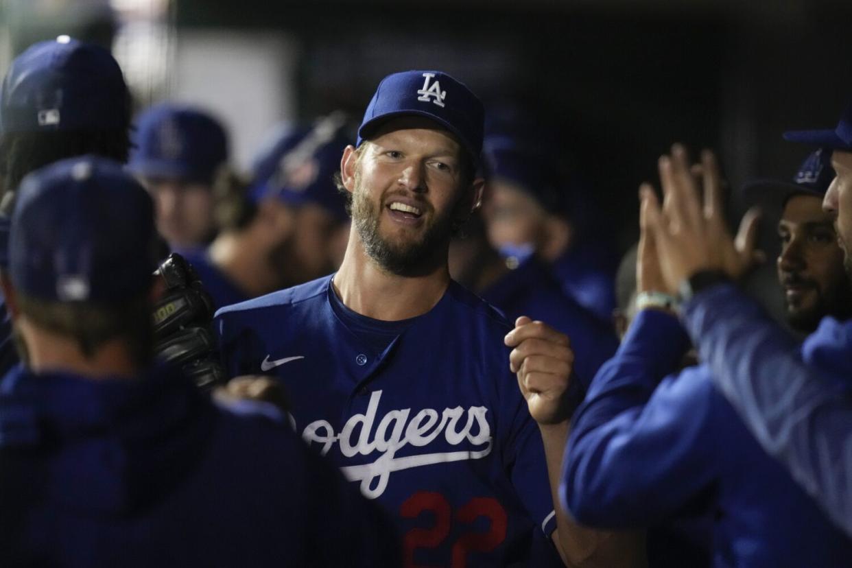 Dodgers' Clayton Kershaw returns to the dugout during a game against the Texas Rangers on March 16, 2023, in Glendale, Ariz.