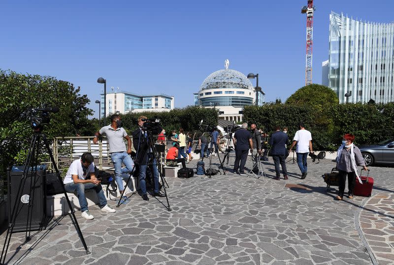 Media gather outside the San Raffaele hospital after Italy's former prime minister Silvio Berlusconi has been hospitalised for further checks after testing positive for the coronavirus disease (COVID-19), in Milan