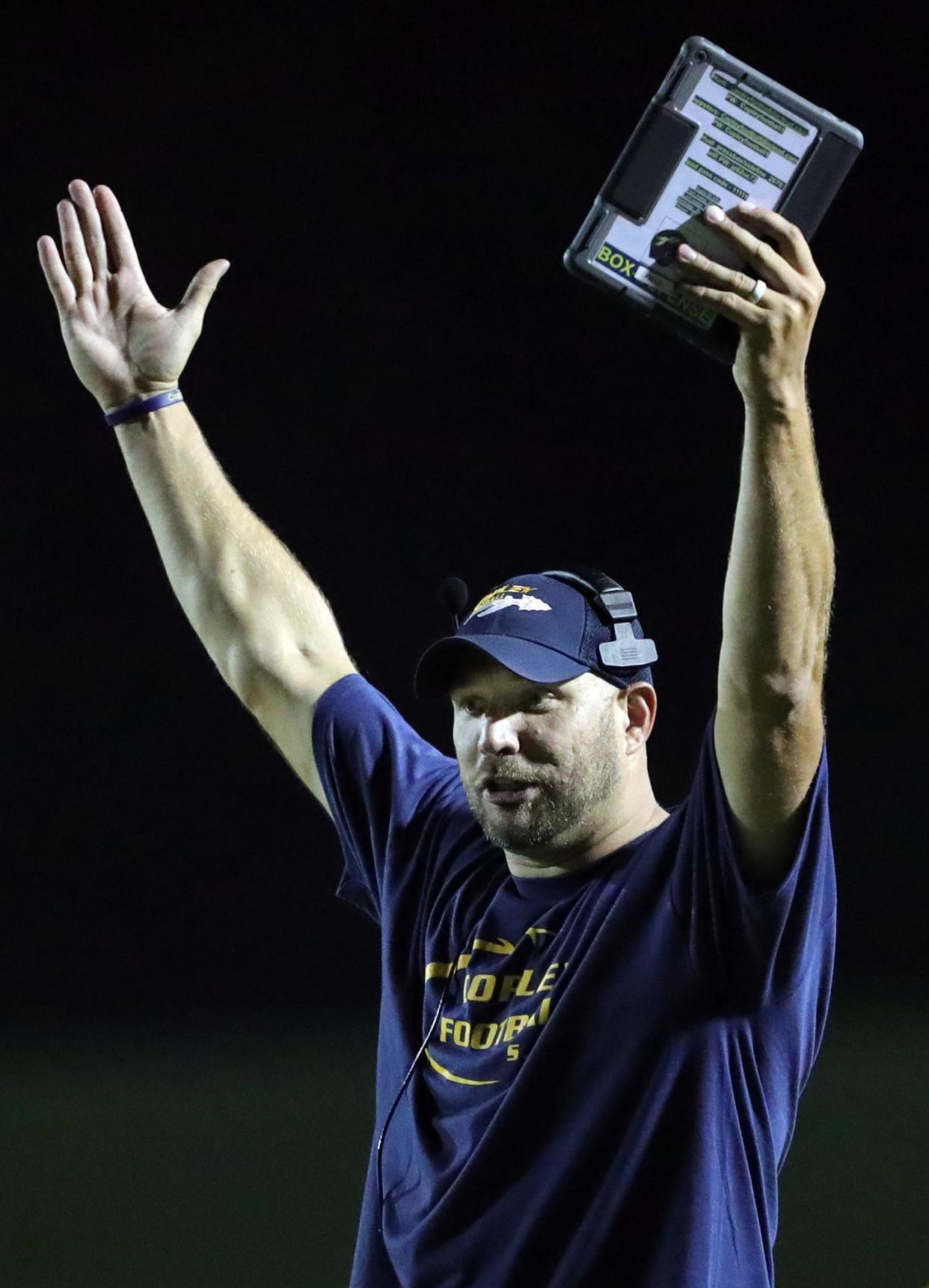 Copley football coach Jake Parsons celebrates a touchdown during the second half of a high school football game, Friday, Aug. 20, 2021, in Copley, Ohio.