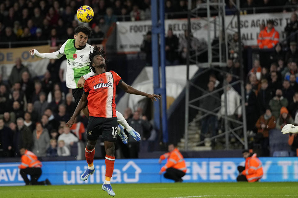 Liverpool's Luis Diaz heads the ball to score his side's first goal during the English Premier League soccer match between Luton Town and Liverpool, at Kenilworth Road, in Luton, England, Sunday, Nov. 5, 2023. (Alastair Grant)