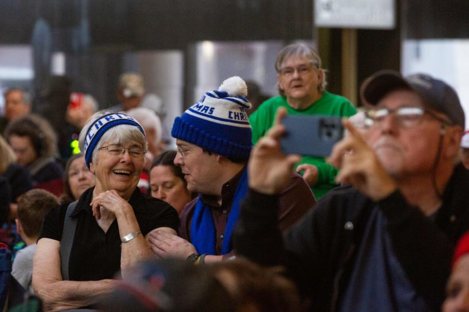 A crowd of about 200 people attend the 33rd Annual Merry TubaChristmas brass instrument concert at the Plains Capital Bank building, on Monday, Dec. 18, 2023, in Corpus Christi, Texas.