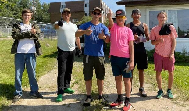 The Men of the North support group encourages men in the Air Ronge and La Ronge area to seek lasting positive mental, physical, emotional and spiritual well-being. The young men in the program are taking on a '40-yard challenge,' working to clean up the yards of 40 elders in their community. (Submitted by Men of the North - image credit)