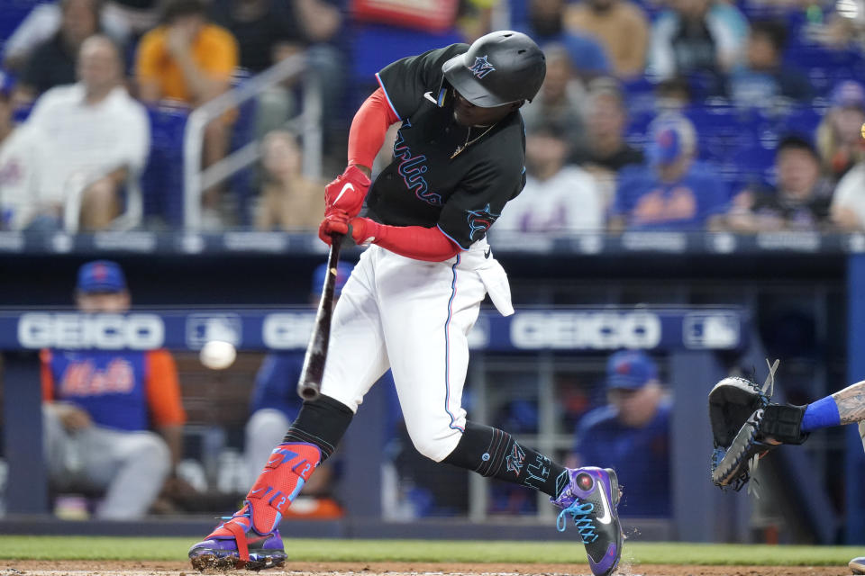 Miami Marlins' Jazz Chisholm Jr. hits a single during the first inning of the team's baseball game against the New York Mets, Friday, June 24, 2022, in Miami. (AP Photo/Lynne Sladky)