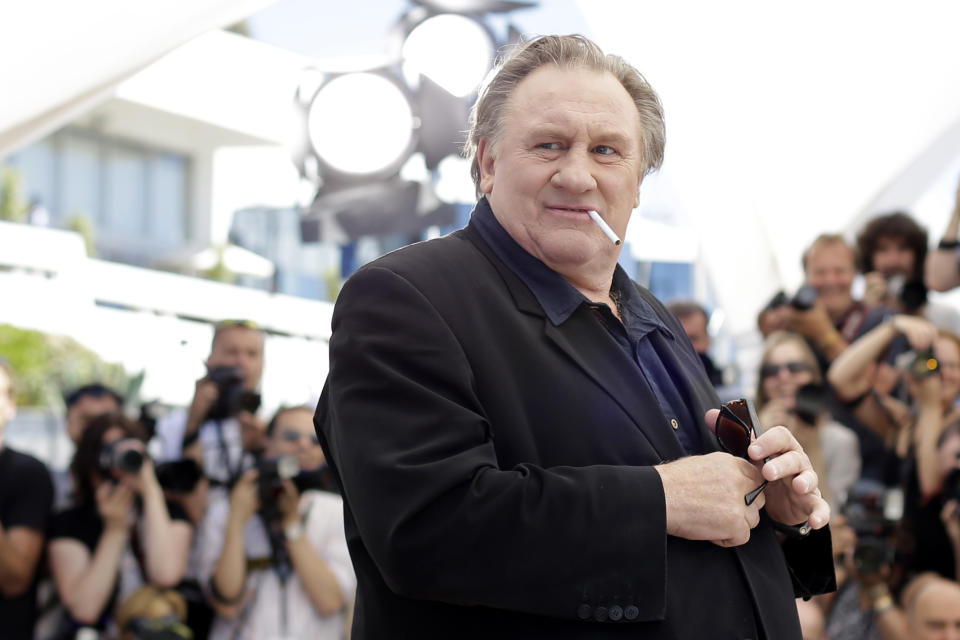 FILE - Actor Gerard Depardieu poses for photographers during a photo call for the film Valley of Love, at the 68th international film festival, Cannes, southern France, Friday, May 22, 2015. More than 50 French performers, writers and producers published an essay Tuesday defending film star and national icon Gerard Depardieu amid growing scrutiny of his behavior toward women. (AP Photo/Thibault Camus, File)