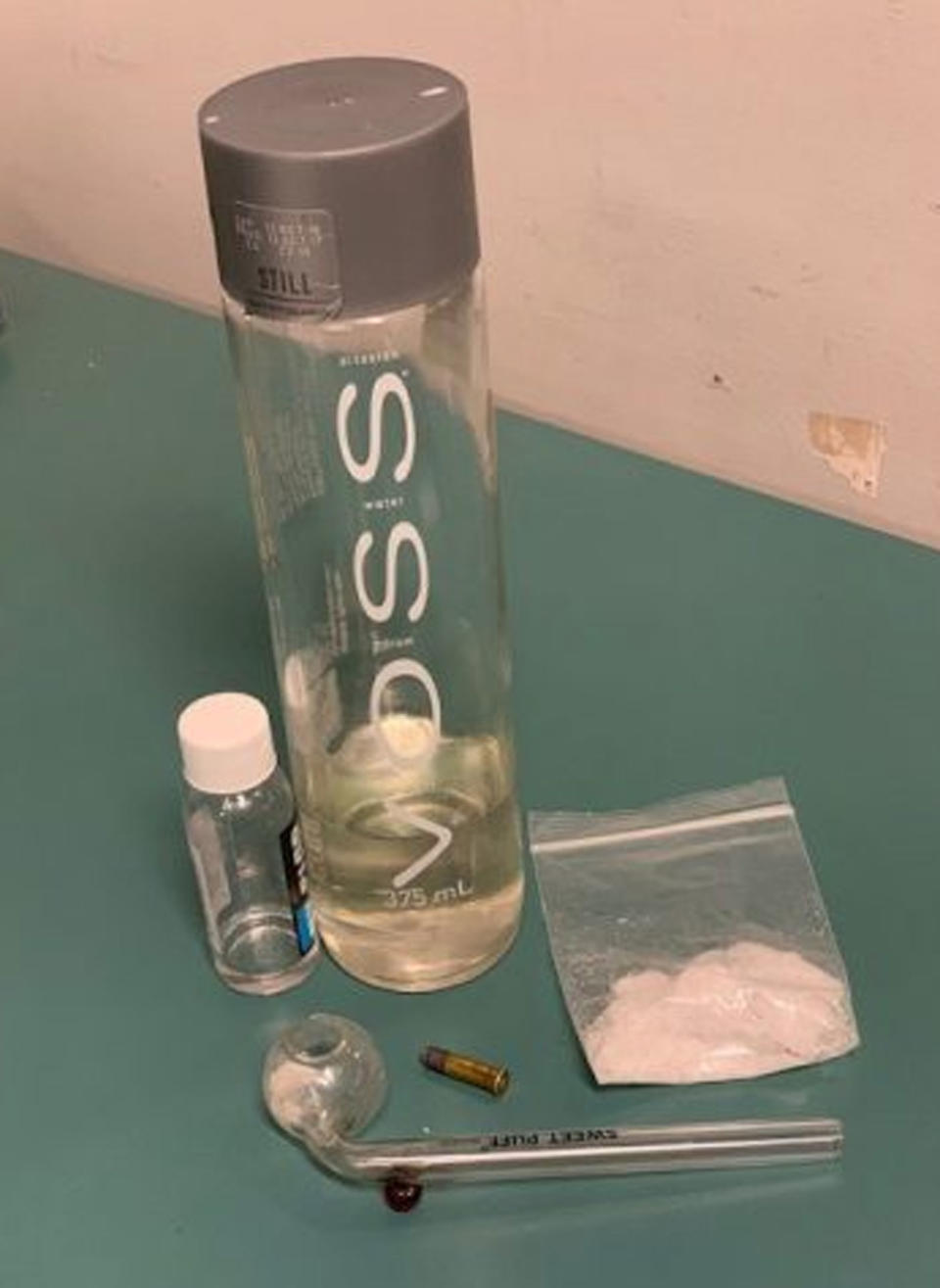 As well as the ice, police also allegedly found a clear liquid suspected of being the drug Fantasy. Photo: Queensland Police