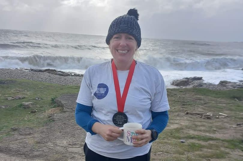 Susie celebrates finishing the Vale of Glamorgan Ultra Marathon, raising funds for Oasis -Credit:Susie Ventris-Fields