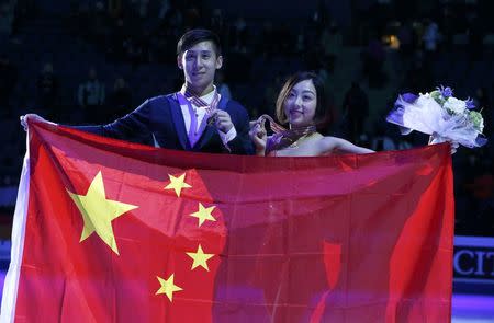 ISU World Championships 2017 - Pairs Victory Ceremony - Helsinki, Finland - 30/3/17 - Gold medallists Sui Wenjing and Han Cong of China attend the ceremony. REUTERS/Grigory Dukor