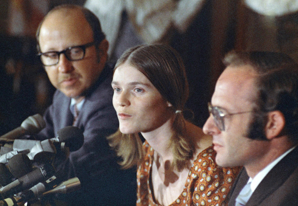 FILE - In this Aug. 19, 1970, file photo, Linda Kasabian speaks at a news conference she held at end of her 18 days on stand as a prosecution witness in the Manson Family murder trials in Los Angeles. Attorneys are Roland Goldman at her left, and Gary Fleischman at her right. Kasabian, the trial's key prosecution witness, was granted immunity from prosecution. She drove the killers to the Tate and LaBianca houses but didn't take part in the killings. Kasabian later changed her name and has for the most part lived out of sight for the past 50 years. (AP Photo/David F. Smith, File)